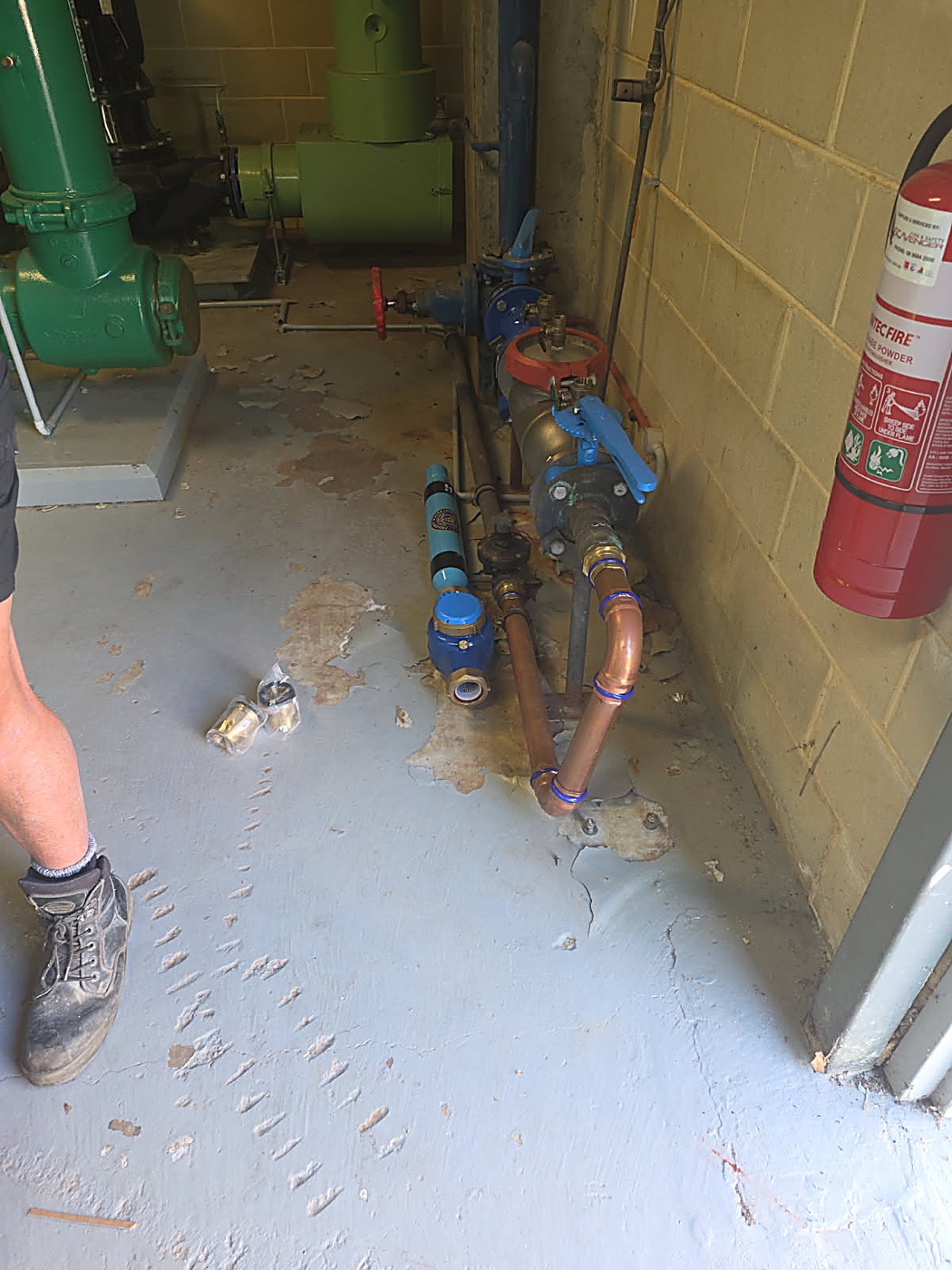 PW200 and new meter laid beside the supply line during fit-up