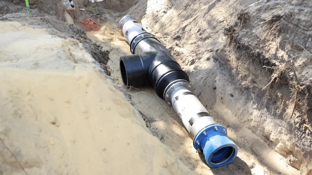 Both units welded inline in the trench, ready for backfill